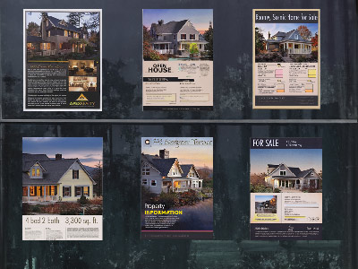 Property flyers in a storefront window